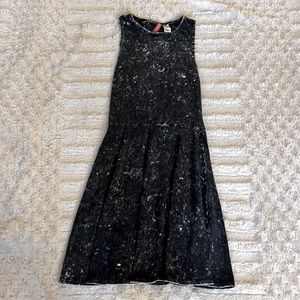 This is a cute vintage black pleated skirt!